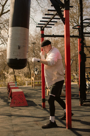 Active Teen Engaged in Boxing Practice Outside