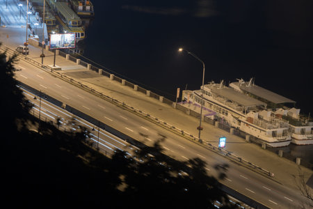Bustle of the city, the road and the car on the bridge at night by the light