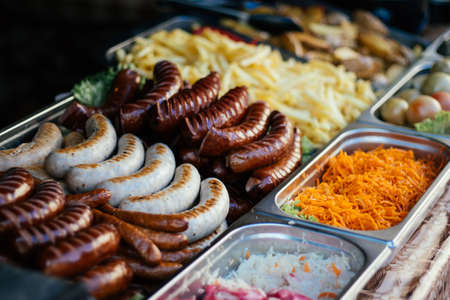 Street fast food outside,  fried sausages, backgroundの写真素材