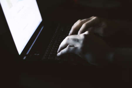 Russian hacker hacking the server in the darkの写真素材