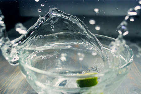 tropical fruits fall deeply under water with a big splashの写真素材