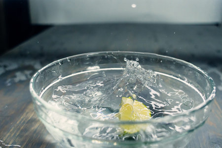 tropical fruits fall deeply under water with a big splashの写真素材