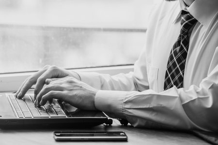 A Person is working with its Laptop