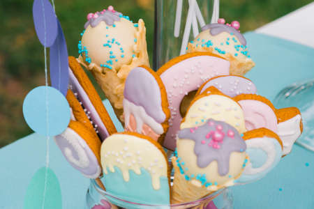 Details of a tasty candy bar with jugs of sweets, cookies and marshmallowsの写真素材