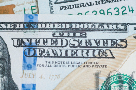 Macro close up of Ben Franklin's face on the US 100 dollar bill.