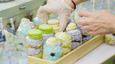 Details of a tasty candy bar with jugs of sweets, cookies and marshmallows, Candy, waffles, cookies...