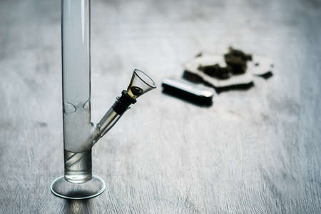 Bong and marijuana, cannabis thc flower Sativa and Indica Close up on a black background. lifestyle Concepts the legalization of marijuana in the world and the United States.の写真素材