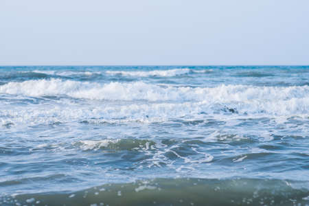 Calm tranquil blue sea with no waves and with foggy backgroudnの写真素材