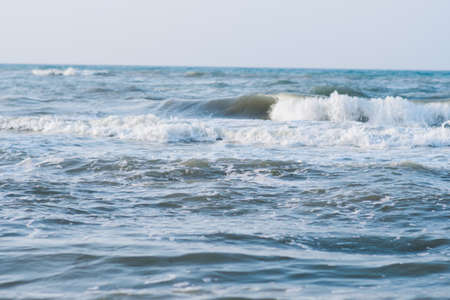 Deep blue stormy sea water surface with foam and waves pattern, natural background photoの写真素材