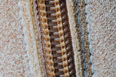 Macro yellow suede boots shoes and shoelaces on wooden background. Autumn or winter shoes. Macroの写真素材