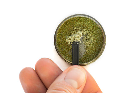 Sticky buds of marijuana flowers with cannabis trihoma, cannabis leaf, the concept of medical use...