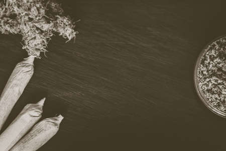 Background of dark wood with cannabis flowers of marijuana weed copy spaceの写真素材