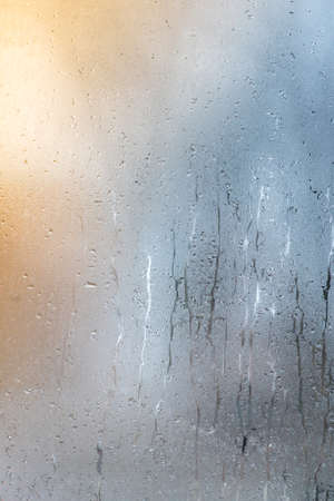 Autumn rain, the inscription on the sweaty glass - question markの写真素材