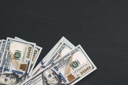 Dollars banknotes on black background.の写真素材