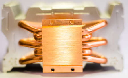 Aluminum radiator with copper heat pipe close-up with beautiful bokeh Concept of air cooling of the central processor of a computer Metallic backgroundの写真素材