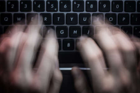 Russian hacker hacking the server in the darkの写真素材