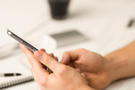 smart phone hands in Hipster Man using smartphone a touch screenvintage colors