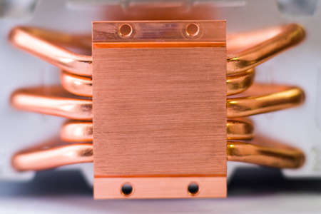 Concept of air cooling of the central processor of a computer Aluminum radiator with copper heat pipe close-up with beautiful bokeh Metallic backgroundの写真素材