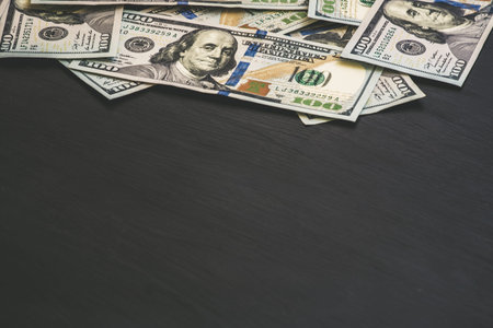 Dollars banknotes on black background.