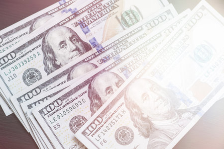 Dollars banknotes on black background.の写真素材