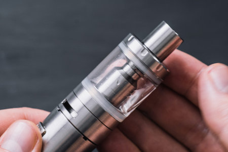 Vaping device in in the man's . Electronic cigarette, vape