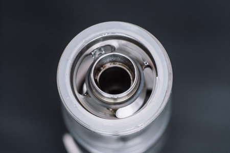 Macro shot of fueling a vape smoking an electronic cigarette, runs vape juice electronic cigarette....