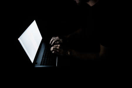 Russian hacker hacking the server in the darkの写真素材