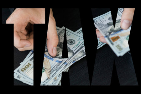 hand recount dollars. the man counts the money. new hundred-dollar bills