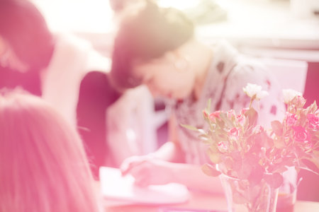 business, education, planning and people concept - close up of female hands with pencil, coffee and...