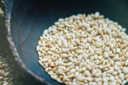 A spoon of seed seeds in a natural wooden spoon in rustic style against the background of a natural...