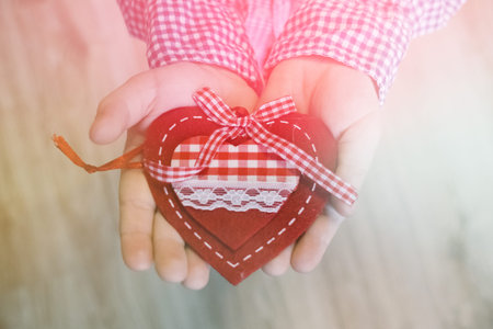 A child holding a heart valentine's day, valentine