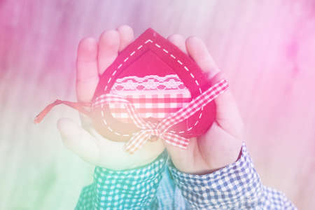A child holding a heart valentine's day, valentine , light toningの写真素材