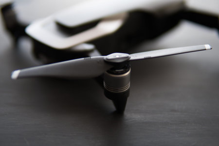 Copy space. Innovation photography concept. Mate color. A new black drone on a black table. Mate...