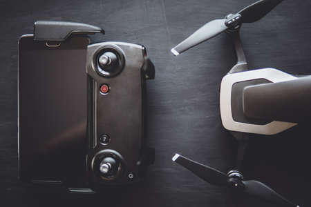 Close up Top view Remote control and smartphone macro Details.の写真素材