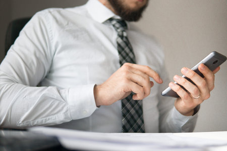 Young bearded businessman Office work with a laptop. Financial business. Businessman work with...