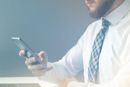 Payment online. Young businessman Smartphone in his hands. Smartphone and Internet Commerce. Online...