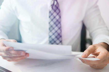 Office work concept. Shopping online. White background. Businessman uses a smartphone. Sending email, mobile phone. Close up telephone.の写真素材