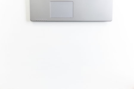 top view copy space. White technological background. Laptop computer on a wooden desk.