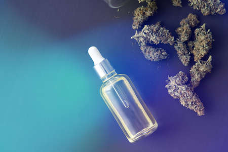 Cannabis oil in pipette, medical marijuana concept, CBD cannabis OIL, close up, light leaks color tonesの写真素材