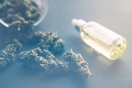 Cannabis oil in pipette, cannabis marijuana concept, CBD medical OIL, close up, light leaks color tonesの写真素材