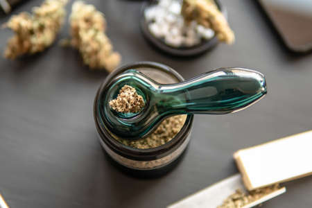 Cannabis legalisation. Marijuana smoking pipe Macro Cannabis budの写真素材