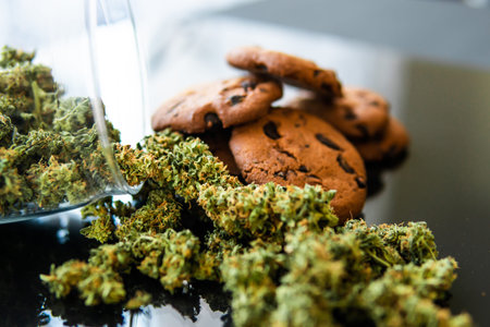 Treatment of medical marijuana for use in food, black background. Concept of cooking with cannabis...