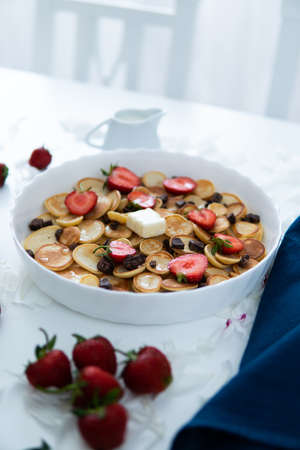 Healthy breakfast eating concept, various morning food - pancakes Home-made breakfast or brunch Pancakes with fresh Strawberry and maple syrup, plenty of copy space.の写真素材