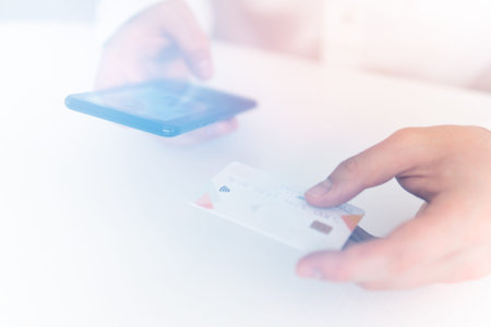Online shopping concept in morning light. Payment online shopping smartphone at working place....