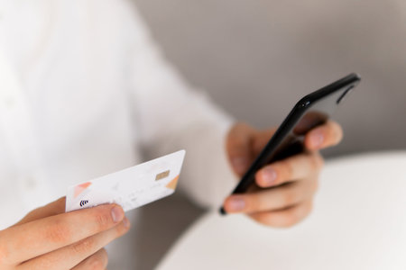 Payment online shopping smartphone at working place. Online shopping concept in morning light....