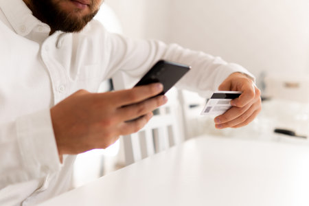 Man's hands holding a credit card Man hand credit card for shopping online. Payment online shopping...
