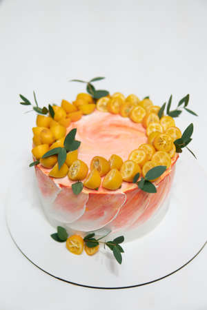 Fresh delicious birthday cake with cream white wood background. cake with candles on table against White background Birthday cake.の写真素材