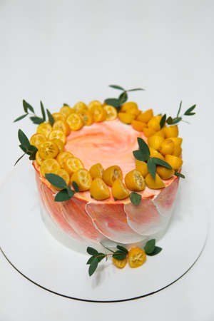 Fresh delicious birthday cake with cream white wood background. White background Birthday cake. cake with candles on table againstの写真素材