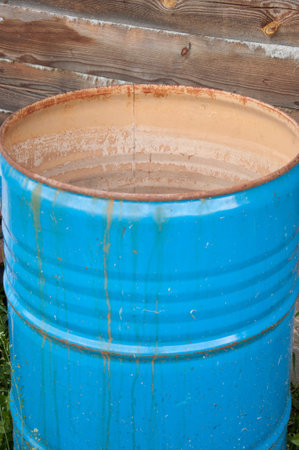 blue barrel standing at the wall of the house