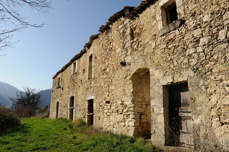 Ancient abandoned stone houses, small town in the Molise region, Italy.の写真素材